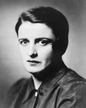 A black and white photo of a woman with short hair.