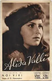 A woman with long hair and a hat is in front of the words alida valli.