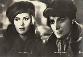 A man and woman in hats are posing for the camera.