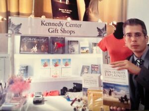 Man holding book at Kennedy Center gift shop