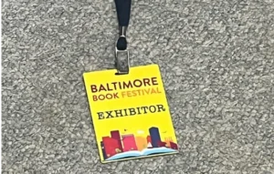 Baltimore Book Festival exhibitor badge on lanyard