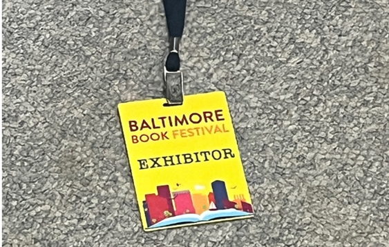 Baltimore Book Festival exhibitor badge on lanyard